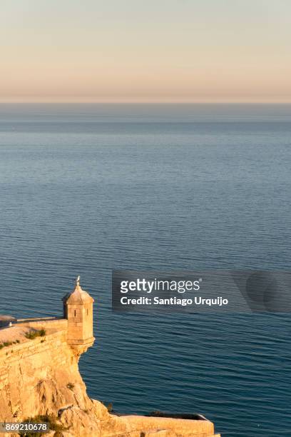 sentry of castle of santa barbara overlooking the mediterranean sea - sentry box ストックフォトと画像