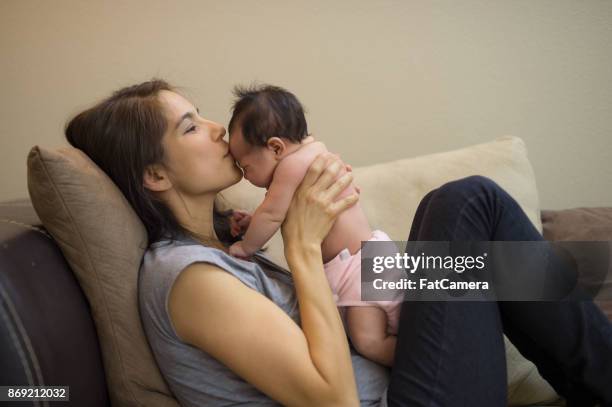 hispanic family celebrates christmas with their newborn! - reusable diaper stock pictures, royalty-free photos & images