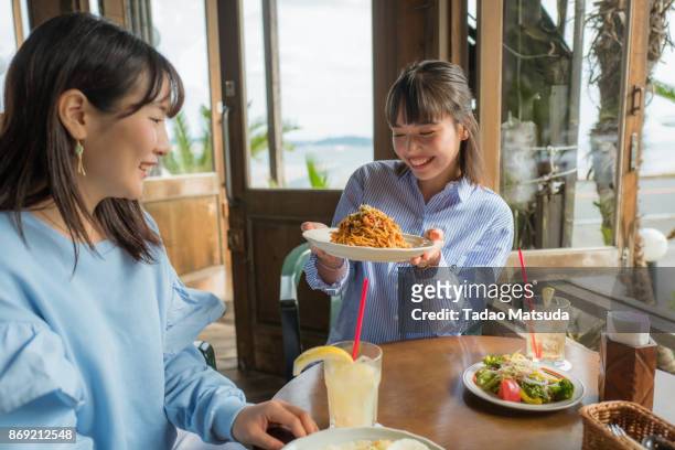 the girls have lunch, at the beach restaurant. - restaurant women friends lunch stock pictures, royalty-free photos & images