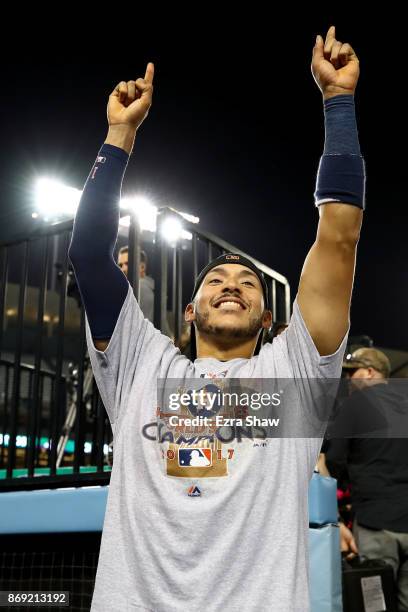 Carlos Correa of the Houston Astros celebrates defeating the Los Angeles Dodgers 5-1 in game seven to win the 2017 World Series at Dodger Stadium on...