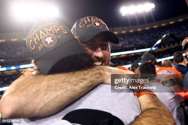 Justin Verlander of the Houston Astros celebrates with teammates on the field after the Astros defeated the Los Angeles Dodgers in Game 7 of the 2017...