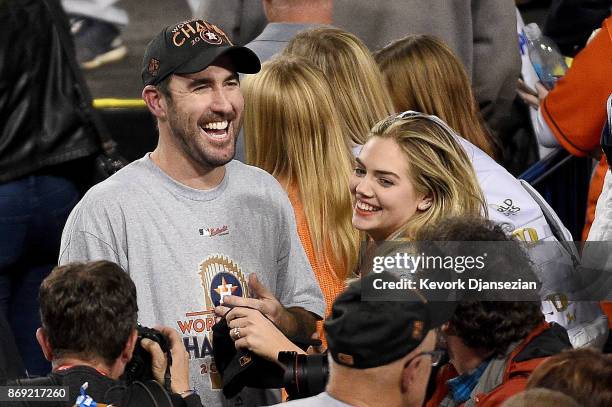 Justin Verlander of the Houston Astros celebrates with fiancee Kate Upton after the Astros defeated the Los Angeles Dodgers 5-1 in game seven to win...