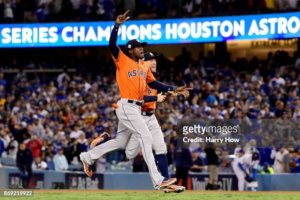 Cameron Maybin and George Springer of the Houston Astros celebrate after defeating the Los Angeles Dodgers 5-1 in game seven to win the 2017 World...