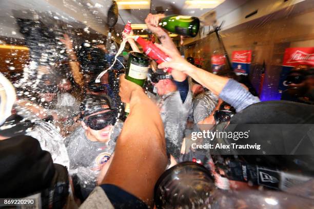 Members of the Houston Astros celebrate in the clubhouse after defeating the Los Angeles Dodgers in Game 7 of the 2017 World Series at Dodger Stadium...