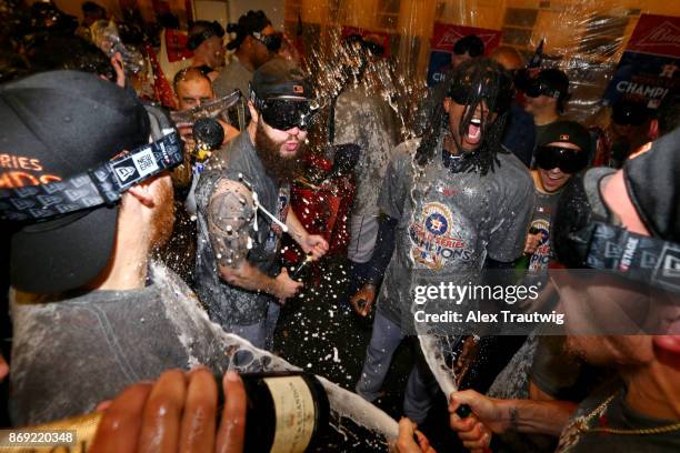 Cameron Maybin and Dallas Keuchel of the Houston Astros celebrate in the clubhouse after the Astros defeated the Los Angeles Dogdgers in Game 7 of...