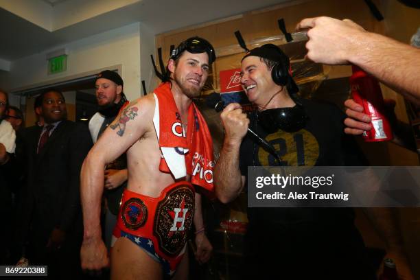 Josh Reddick of the Houston Astros talks to the media in the clubhouse after the Astros defeated the Los Angeles Dogdgers in Game 7 of the 2017 World...