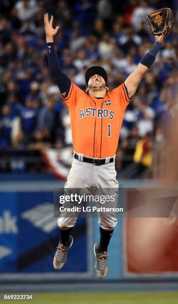 Carlos Correa of the Houston Astros celebrates after the final out of Game 7 of the 2017 World Series against the Los Angeles Dodgers at Dodger...