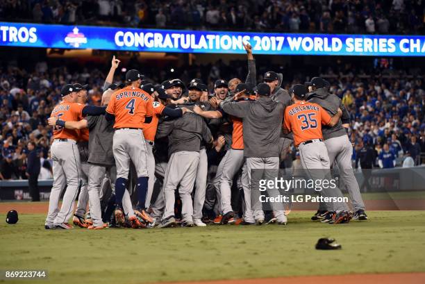 The Houston Astros celebrate after the final out of Game 7 of the 2017 World Series against the Los Angeles Dodgers at Dodger Stadium on Wednesday,...