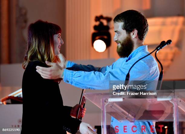 Asia Whiteacre accepts an award from Mike Posner onstage during Spotify's Inaugural Secret Genius Awards hosted by Lizzo at Vibiana on November 1,...
