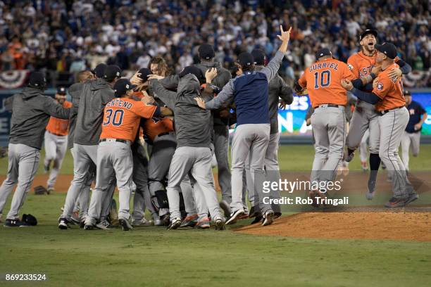 Members of the Houston Astros celebrate on the field after the Astros defeated the Los Angeles Dodgers in Game 7 of the 2017 World Series at Dodger...