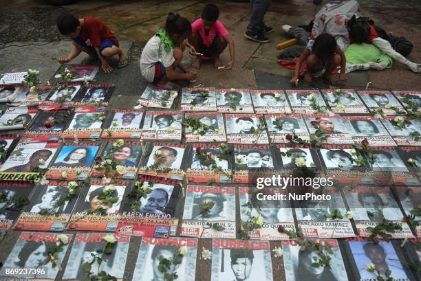 Families of the desaparecidos from alleged extra judicial killings from different administrations conduct a protest at the Plaza Miranda in Quiapo,...