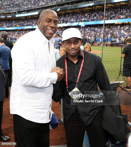 Magic Johnson and Stephen A. Smith attend The 2017 World Series - Game 7 at Dodger Stadium on November 1, 2017 in Los Angeles, California.