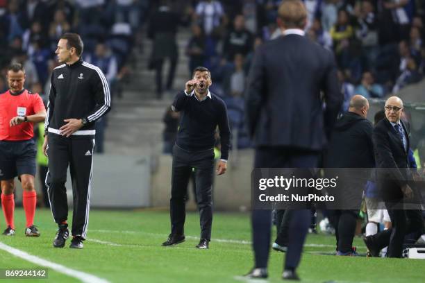 Porto's Portuguese head coach Sergio Conceicao reacts with Head coach Ralph Hasenhuttl of Leipzig during the UEFA Champions League Group G match...