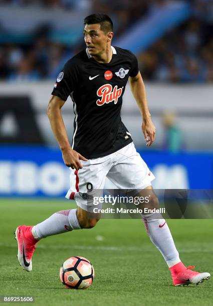 Oscar Cardozo of Libertad drives the ball during a second leg match between Racing Club and Libertad as part of the quarter finals of Copa CONMEBOL...