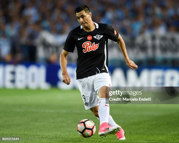 Oscar Cardozo of Libertad kicks the ball during a second leg match between Racing Club and Libertad as part of the quarter finals of Copa CONMEBOL...