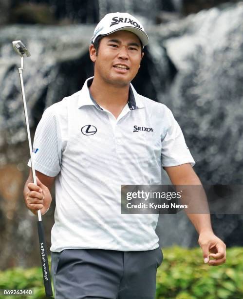 Japanese golfer Hideki Matsuyama reacts after missing a birdie on the 17th hole during the first round of the CIMB Classic, a U.S. PGA Tour event, in...