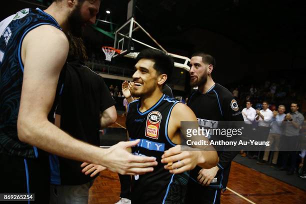 Shea Ili of the Breakers is congratulated by teammates after winning the round five NBL match between the New Zealand Breakers and the Adelaide 36ers...
