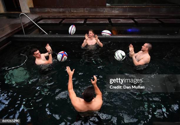 George Ford, Owen Farrell, Ben Youngs and Mike Brown of England complete a passing drill during a recovery session at the Hilton Vilamoura on...