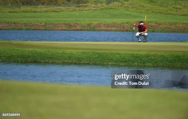 Oscar Lengden of Sweden lines up a putt on the 5th green on Day Two of the NBO Golf Classic Grand Final - European Challenge Tour at Al Mouj Golf on...