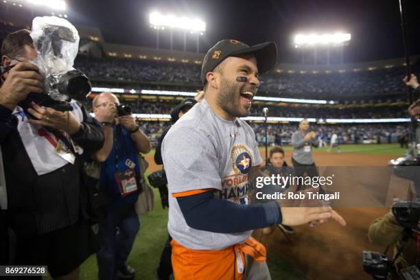 Jose Altuve of the Houston Astros celebrates on the field after the Astros defeated the Los Angeles Dodgers in Game 7 of the 2017 World Series at...