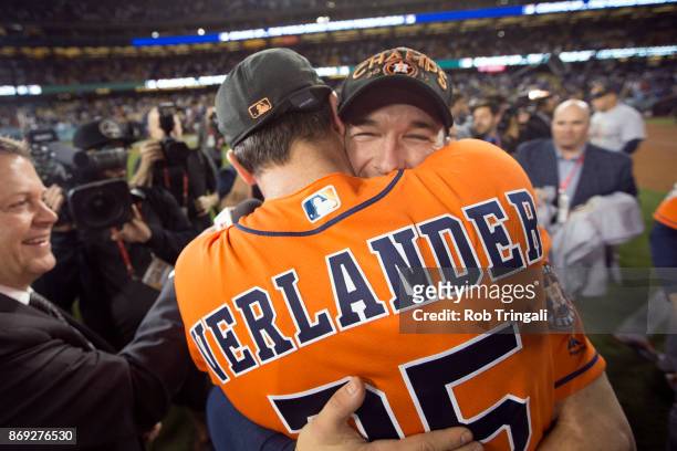 Justin Verlander and Alex Bregman of the Houston Astros celebrate on the field after the Astros defeated the Los Angeles Dodgers in Game 7 of the...