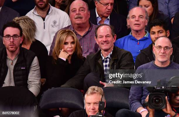 Roxana Girand and Eliot Spitzer attend the Houston Rockets Vs New York Knicks game at Madison Square Garden on November 1, 2017 in New York City.