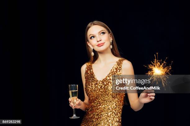 smiling girl with christmas sparkler - champagne flute milk stock pictures, royalty-free photos & images