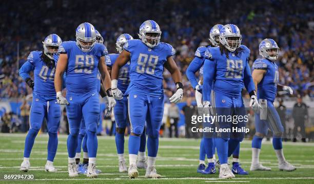 Anthony Zettel, Jeremiah Ledbetter and Taylor Decker of the Detroit Lions line up during the fourth quarter of the game against the Pittsburgh...