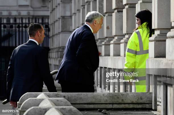 Sir Michael Fallon arrives with a close protection officer at the Cabinet Office on November 1, 2017 in London, United Kingdom. Sir Michael Fallon...