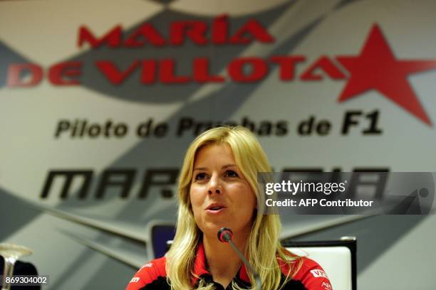 Formula One team Marussia driver Maria De Villota of Spain speaks during a press conference in Madrid on March 9, 2012. AFP PHOTO/JAVIER SORIANO. /...