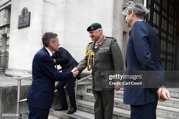 Gavin Williamson is greeted by Vice Chief of the Defence Staff Gordon Messenger and Permanent Secretary at the Ministry of Defence Stephen Lovegrove...