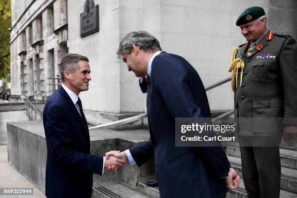 Gavin Williamson is greeted by Vice Chief of the Defence Staff Gordon Messenger and Permanent Secretary at the Ministry of Defence Stephen Lovegrove...