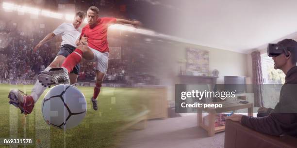 man at home with vr headset watching virtual reality soccer - immersive stock pictures, royalty-free photos & images