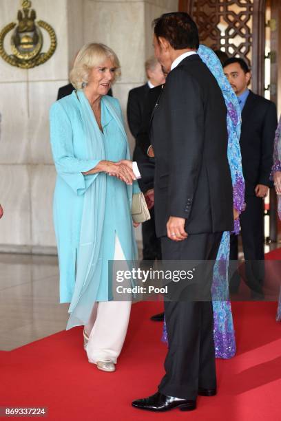 Camilla, Duchess of Cornwall shakes his Majesty Hassanal Bolkiah, The Sultan of Brunei's hand at the Istana Nurul Iman on November 2, 2017 in ,...