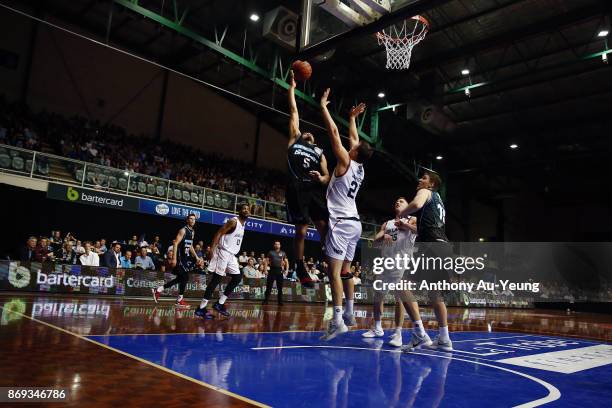 Shea Ili of the Breakers goes up against Daniel Johnson of the 36ers during the round five NBL match between the New Zealand Breakers and the...