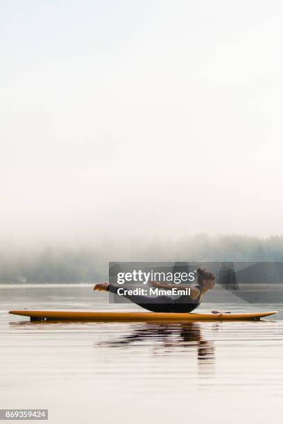 sup yoga - locust pose - salabhasana - salabhasana stock pictures, royalty-free photos & images