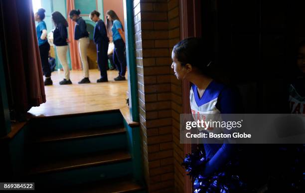 Cheerleader at Up Academy Leonard in Lawrence, MA watches as the Step Team performs for what they think will be a school assembly, but will really be...