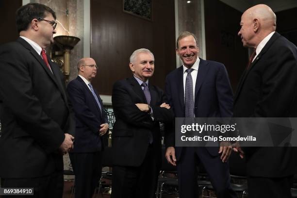 Senate Armed Services Committee ranking member Sen. Jack Reed talks with Defense Department nominees Robert Wilkie , Joseph Kernan and Guy Roberts...