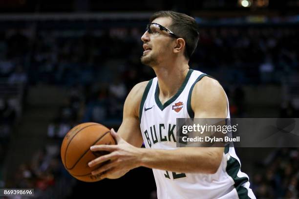 Mirza Teletovic of the Milwaukee Bucks attempts a shot in the fourth quarter against the Oklahoma City Thunder at the Bradley Center on October 31,...