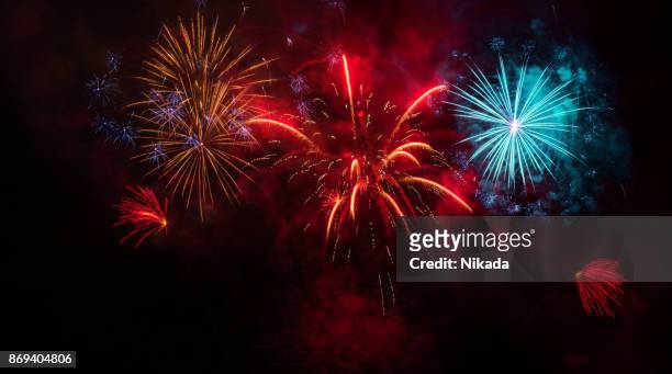 colorful fireworks display - firework display imagens e fotografias de stock