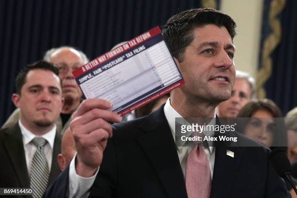 Speaker of the House Rep. Paul Ryan holds up a postcard size tax return form during a news conference on the tax reform legislation November 2, 2017...