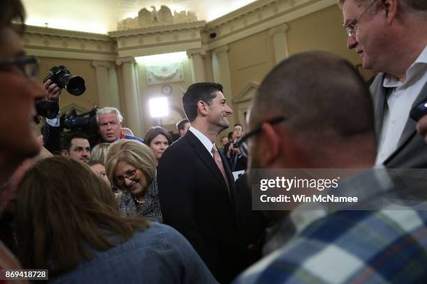 Speaker of the House Paul Ryan greets families who took part in the introduction of the House Republican tax reform legislation November 2, 2017 in...