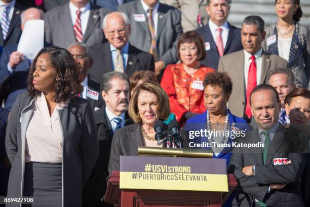 House Minority Leader Nancy Pelosi speaks at a press conference to show solidarity with the people of Puerto Rico and U.S. Virgin Islands after the...