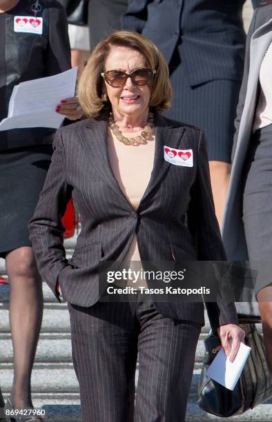 House Minority Leader Nancy Pelosi attends a press conference to show solidarity with the people of Puerto Rico and U.S. Virgin Islands after the...