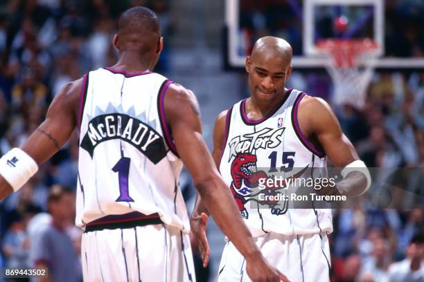 Tracy McGrady and Vince Carter of the Toronto Raptors look on circa 1999 at the Air Canada Centre in Toronto, Ontario. NOTE TO USER: User expressly...