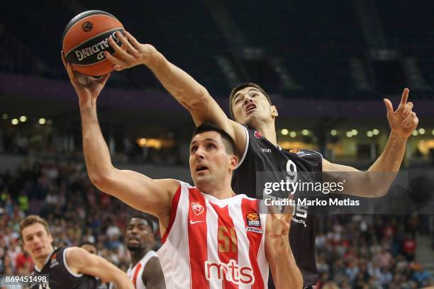 Milko Bjelica, #51 of Crvena Zvezda mts Belgrade competes with Luka Mitrovic, #9 of Brose Bamberg during the 2017/2018 Turkish Airlines EuroLeague...