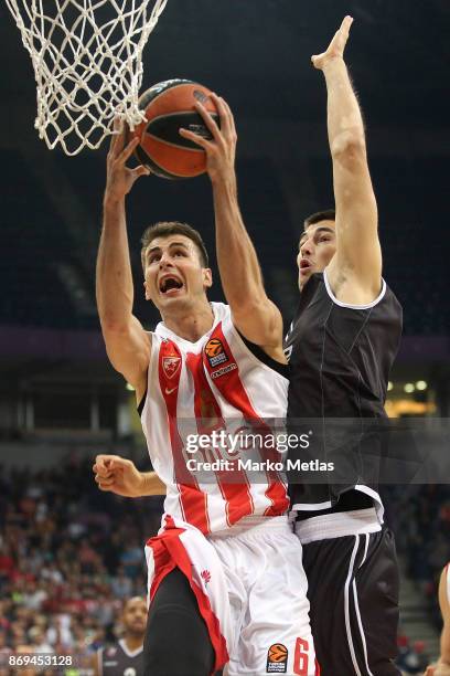 Nemanja Dangubic, #6 of Crvena Zvezda mts Belgrade competes with Luka Mitrovic, #9 of Brose Bamberg during the 2017/2018 Turkish Airlines EuroLeague...