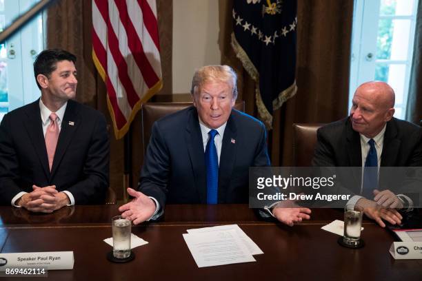 Flanked by Speaker of the House Paul Ryan and House Ways and Means Committee chairman Rep. Kevin Brady , President Donald Trump speaks about tax...