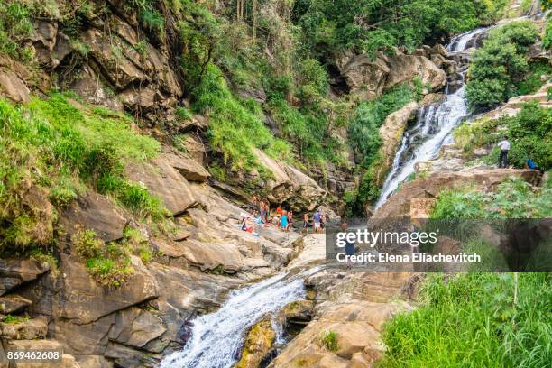 elna, sri lanka -2. mai 2016. tourists exploring rawana waterfall. - eliachevitch stock pictures, royalty-free photos & images