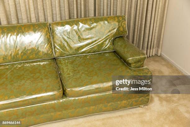 antique sofa covered in plastic - antique sofa styles foto e immagini stock